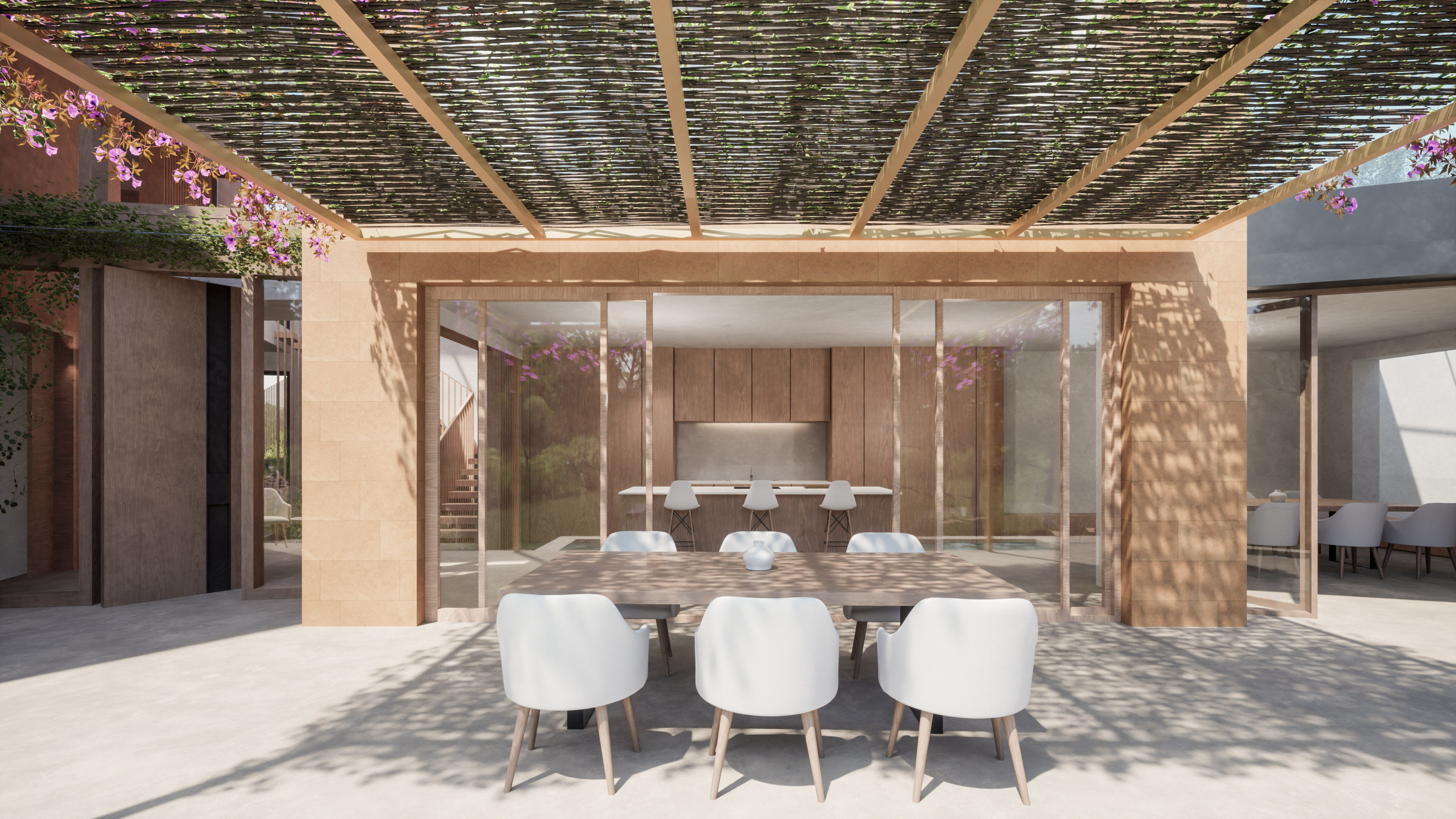 Comedor exterior bajo la pérgola de cañizo junto a la cocina de Villa Es Pinar