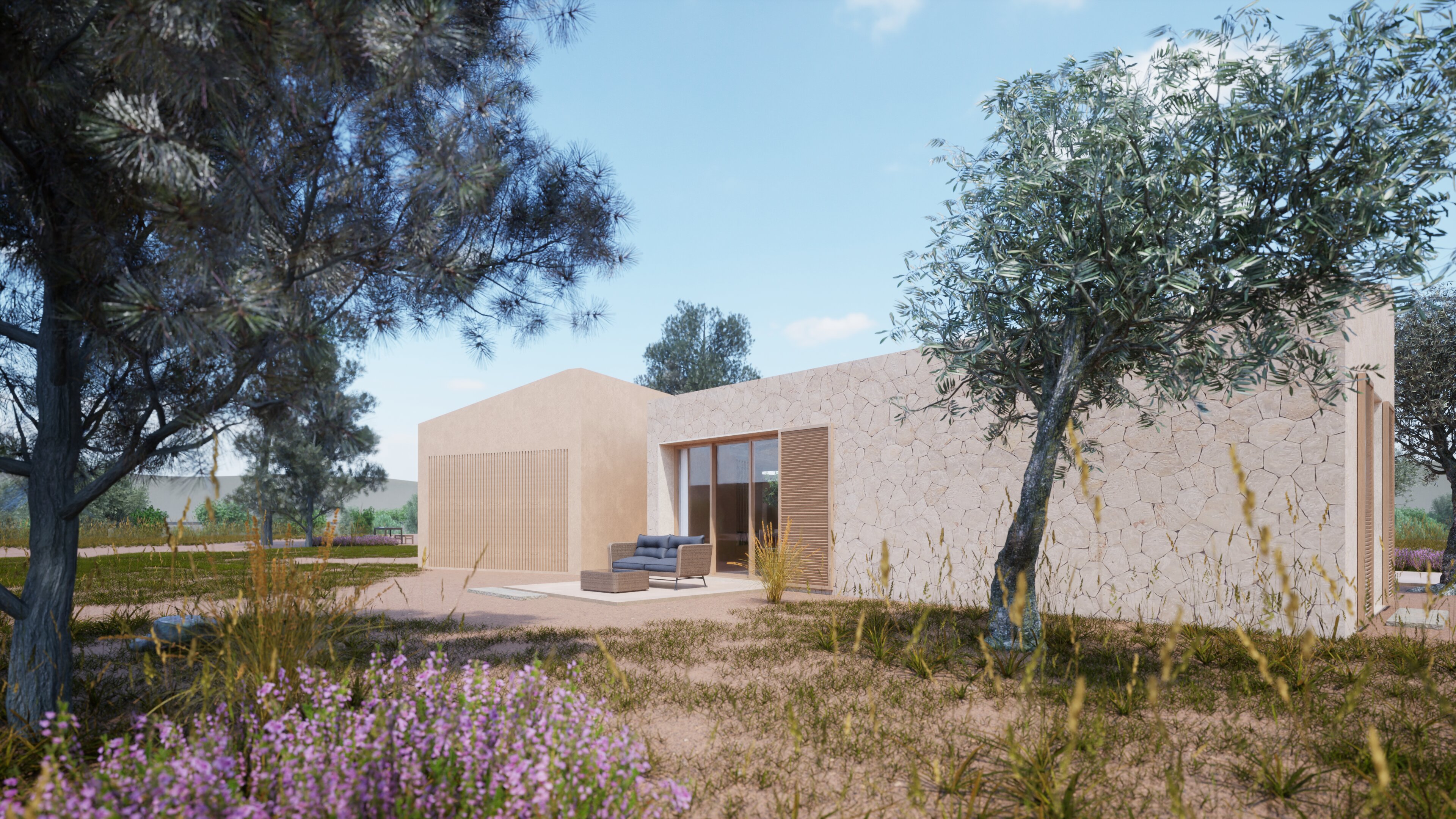 Fachada de piedra de Finca Es Camp entre pinos y olivos